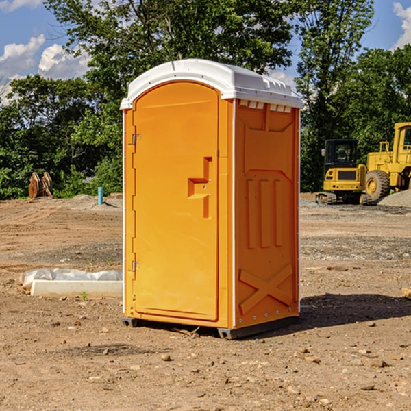 what is the cost difference between standard and deluxe portable restroom rentals in Carey